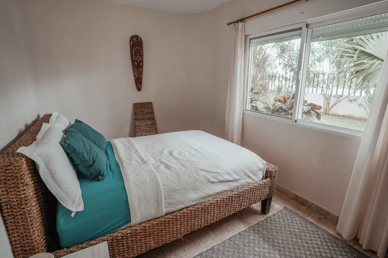 Extra bedroom with double bed and tropical garden view at the condo